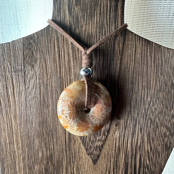 Light Yellow Coral Fossil Donut Pendant Necklace on Brown Faux Suede - Picture 3 of 11